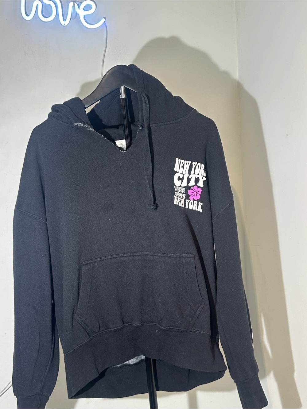 H&M Black Hoodie with White New York Text and Pink Floral Accent